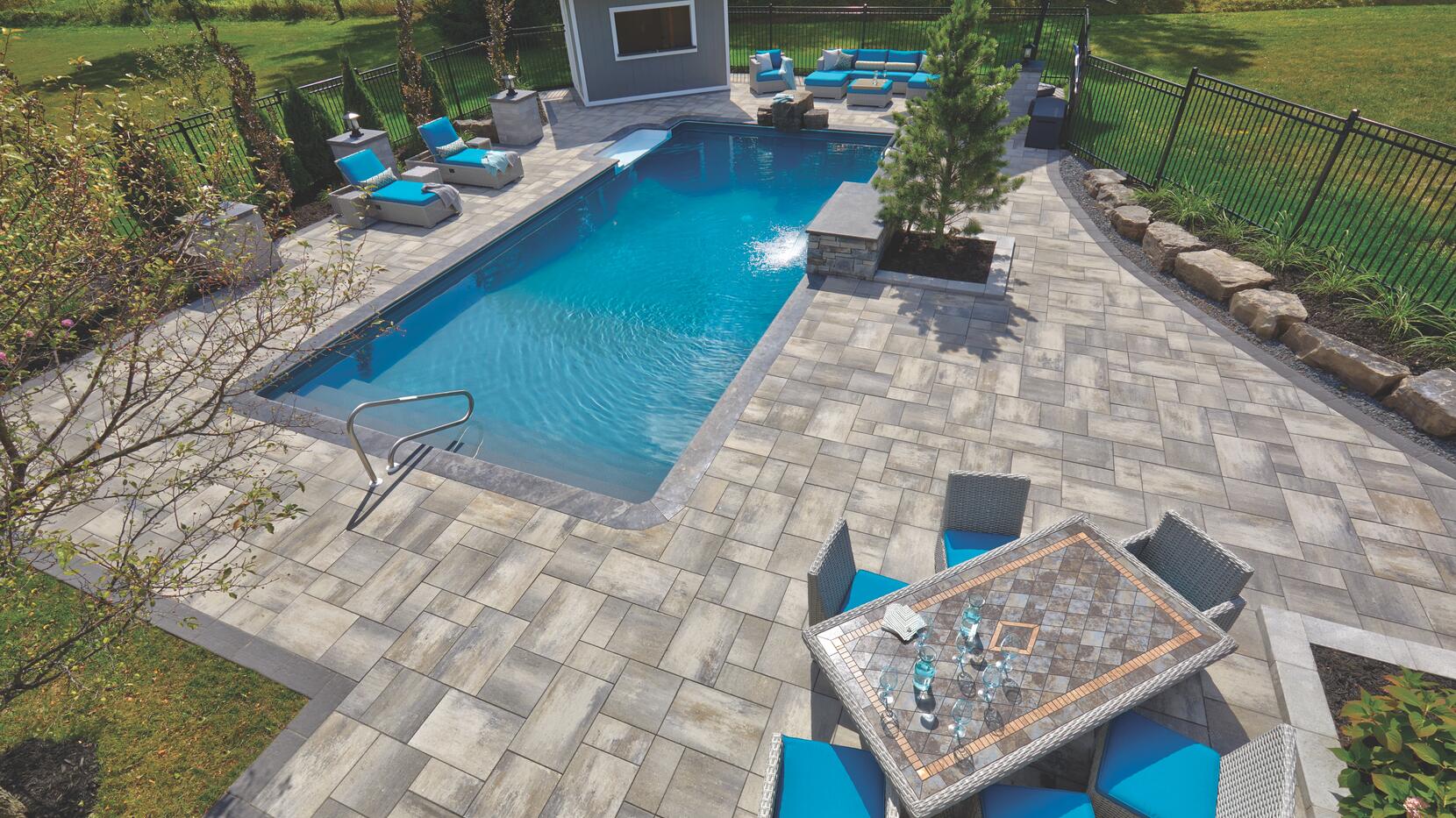 Backyard patio and pool deck using Nueva Slab by Oaks Landscape Products