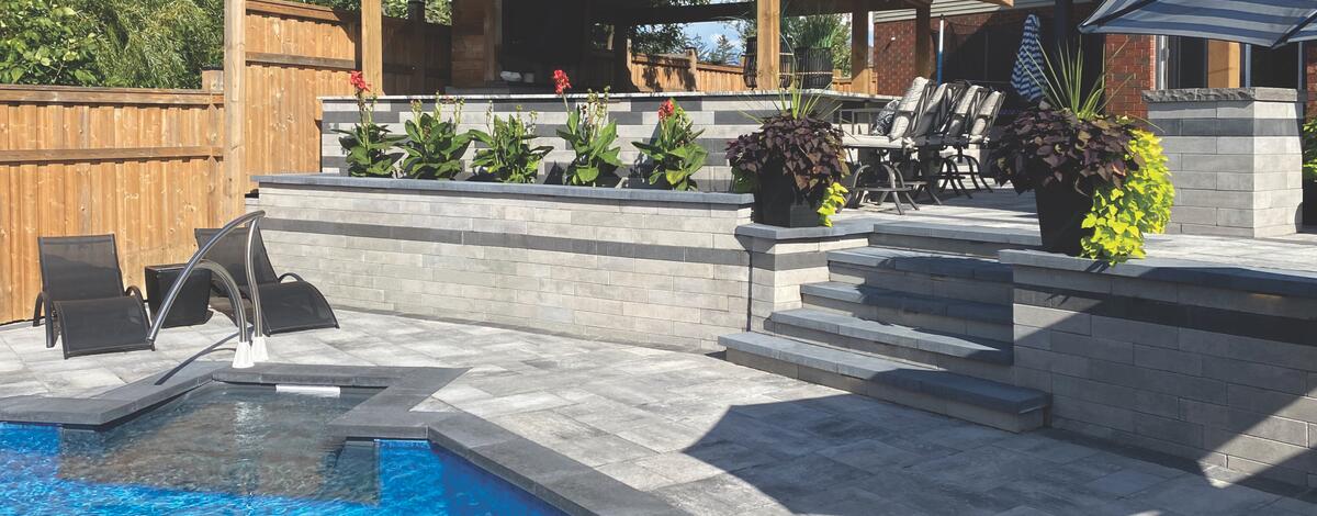 Backyard pool deck and walls using Oaks Landscape products