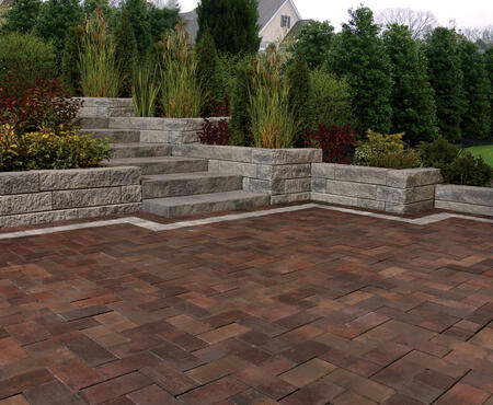 Patio with stairs and wall using Gardenia Linear, Market Paver and Aria Step products from Brampton Brick