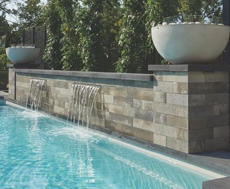 Pool waterfall using Modan wall by Oaks Landscape Products