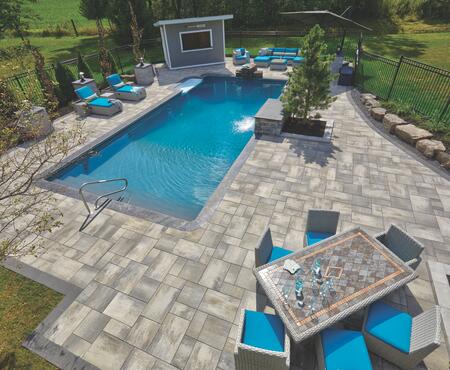 Patio with pillars and planter wall using Nueva® Slab, Monterey and Modan products from Brampton Brick