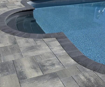 Pool and patio pavers using Nueva Slab and Cassina Coping products from Brampton Brick