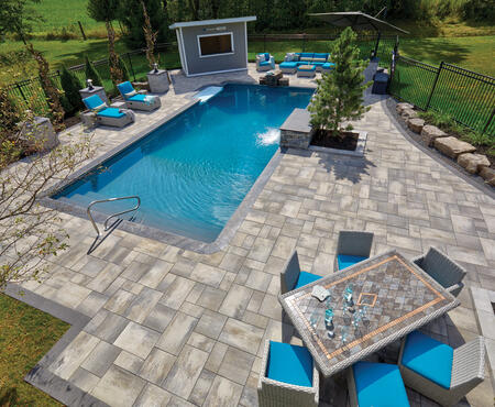 Patio with pillars and planter wall using Nueva® Slab, Monterey and Modan products from Brampton Brick